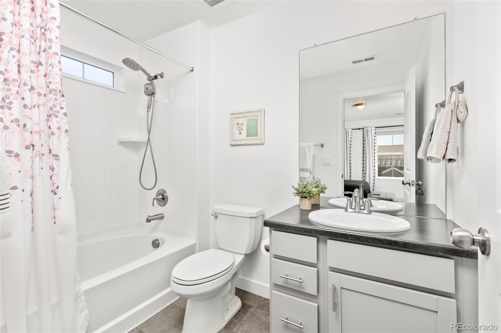 5067 Preserve Place Firestone, CO 80504 - Photo 33 of 50 a bathroom with a sink a toilet and shower