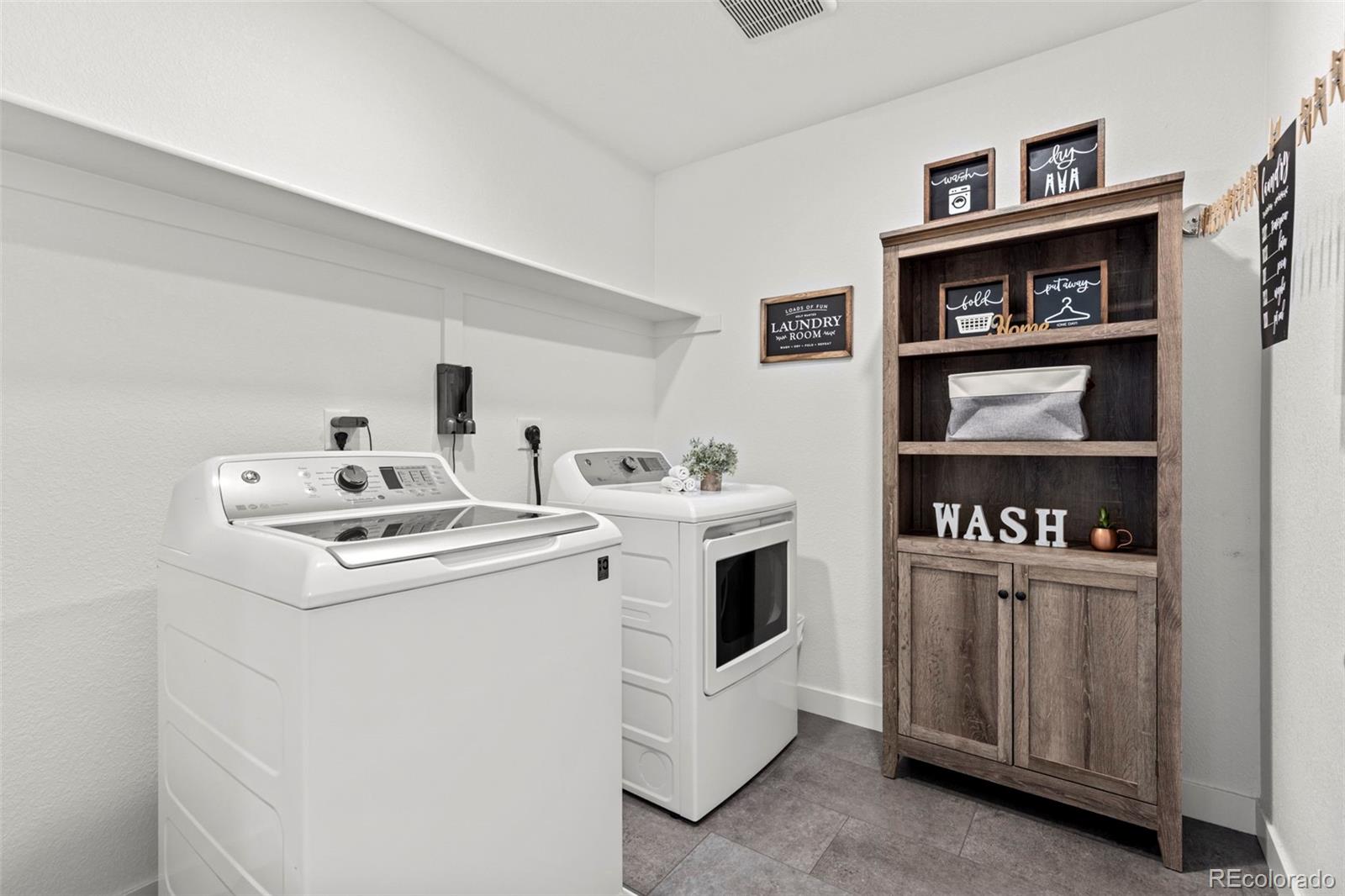 5067 Preserve Place Firestone, CO 80504 - Photo 37 of 50 a utility room with dryer and washer