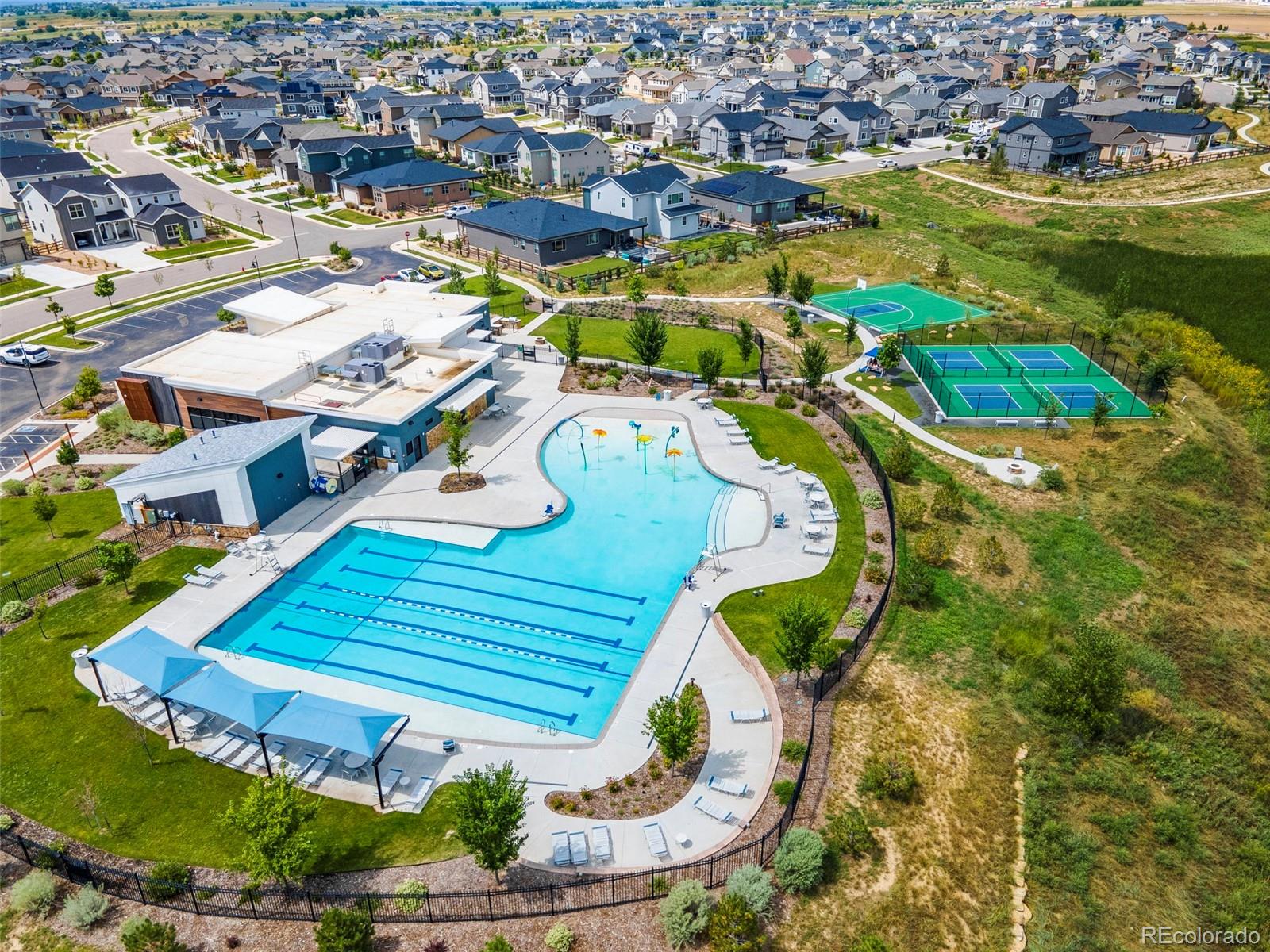 5067 Preserve Place Firestone, CO 80504 - Photo 48 of 50 an aerial view of a house with a swimming pool yard and outdoor seating