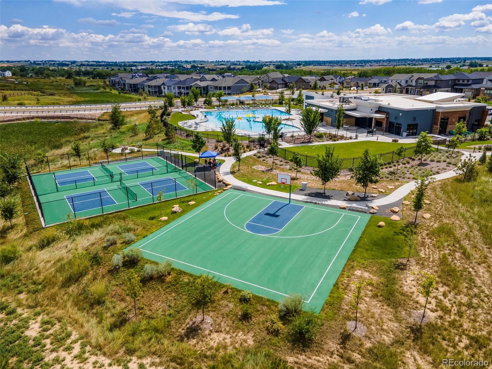 5067 Preserve Place Firestone, CO 80504 - Photo 49 of 50 an aerial view of a houses with a swimming pool