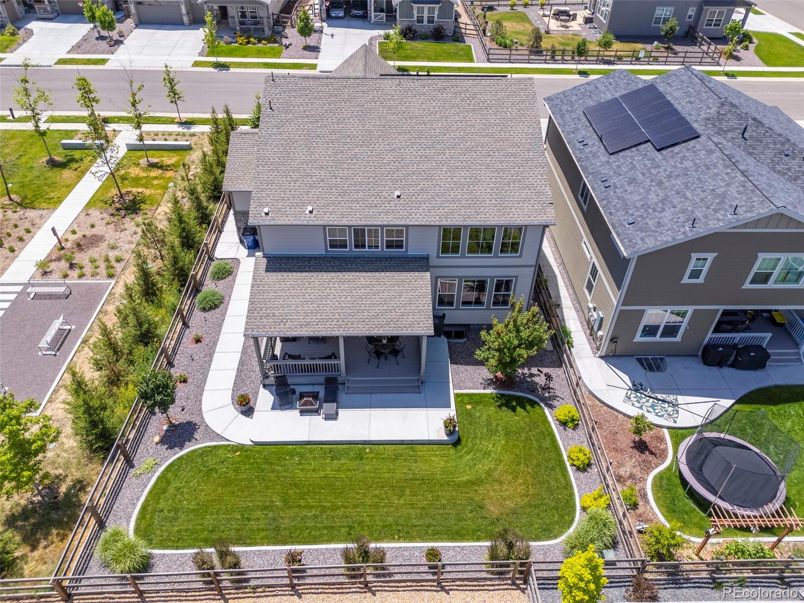 5067 Preserve Place Firestone, CO 80504 - Photo 6 of 50 an aerial view of a house with swimming pool and a yard