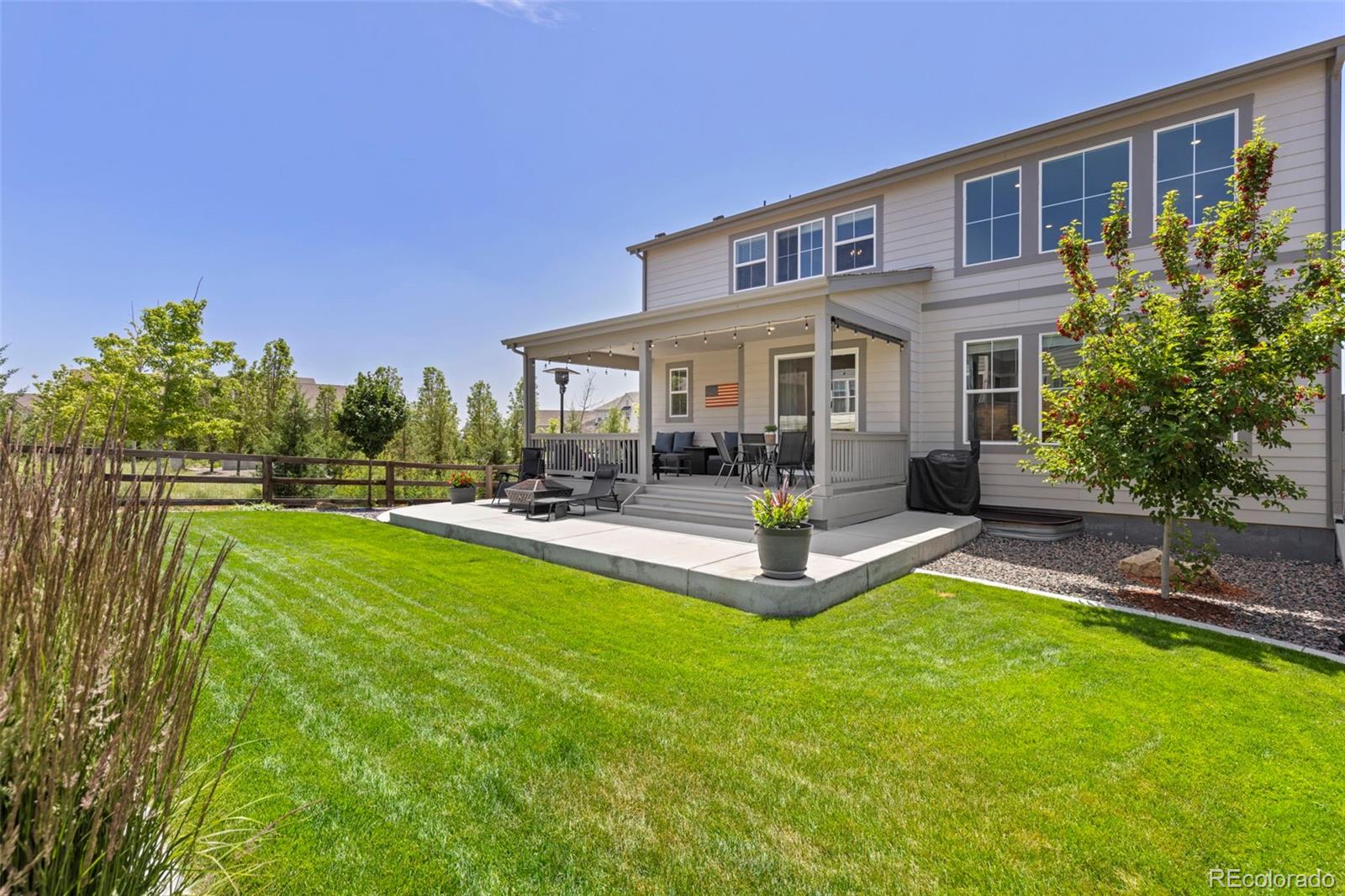 5067 Preserve Place Firestone, CO 80504 - Photo 8 of 50 a view of a house with swimming pool and a yard