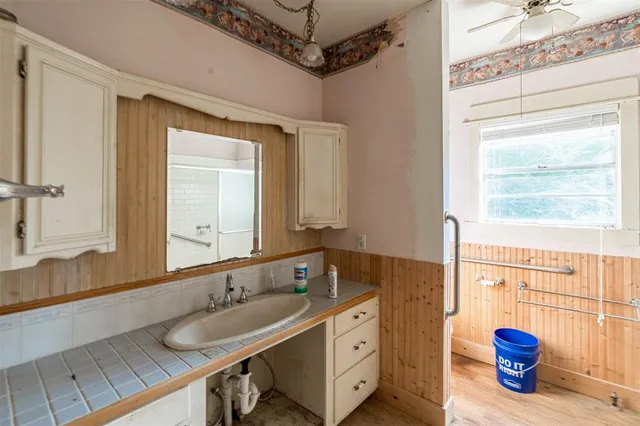 a bathroom with a sink and a mirror