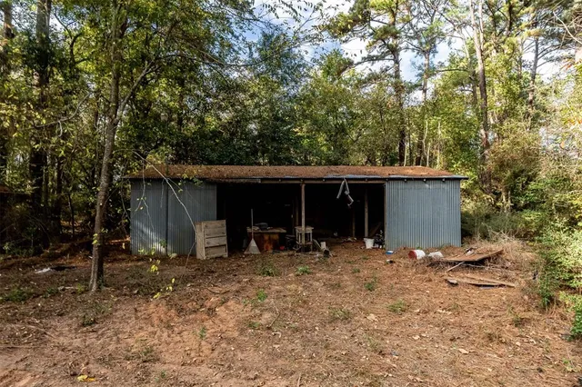 a view of house with trees in the background