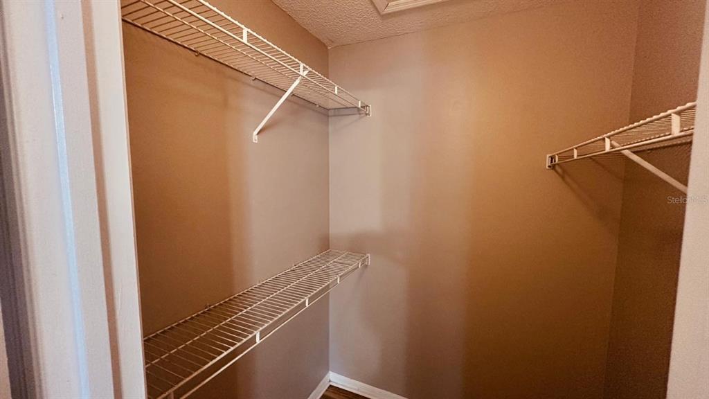 1087 South Hiawassee Road, Unit 422 Orlando, FL 32835 - Photo 11 of 17 a view of a room with racks on the wall
