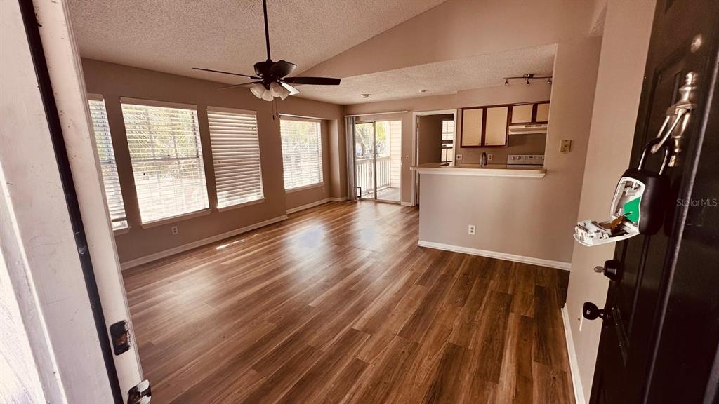 1087 South Hiawassee Road, Unit 422 Orlando, FL 32835 - Photo 7 of 17 a view of empty room with wooden floor and fan