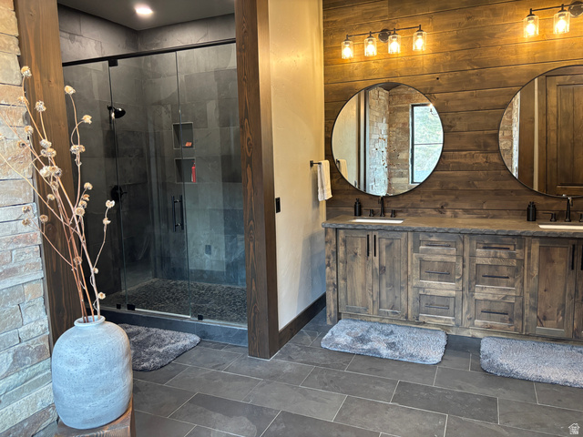 259 Meadow Drive Springville, UT 84663 - Photo 22 of 62 Bathroom with double vanity, wooden walls, and a shower stall