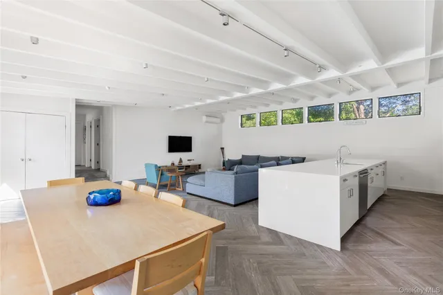 a living room with furniture and flat screen tv