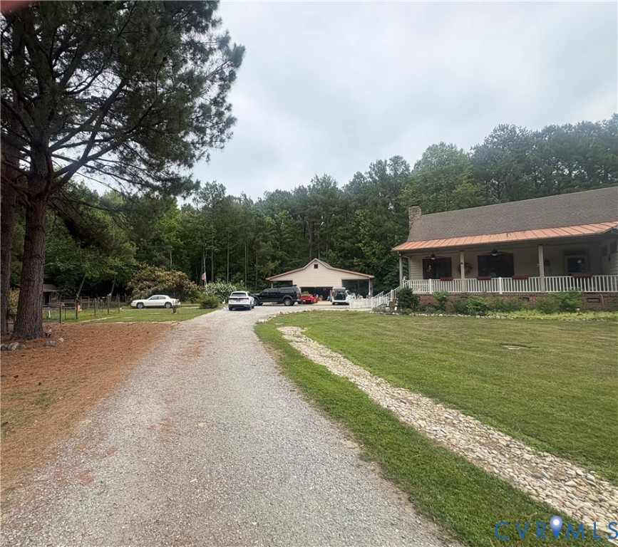 4215 Newville Road Waverly, VA 23890 - Photo 5 of 5 Gravel driveway leading to a residence with a cove