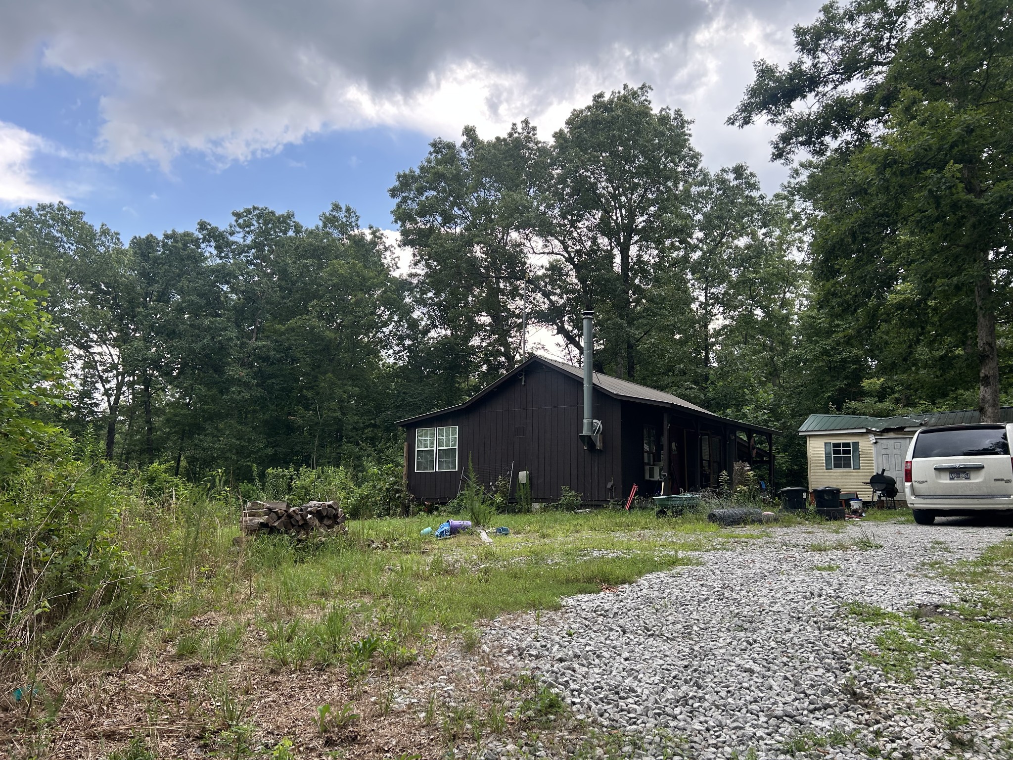 170 Deer Run Loop Altamont, TN 37301 - Photo 12 of 19 a front view of a house with garden