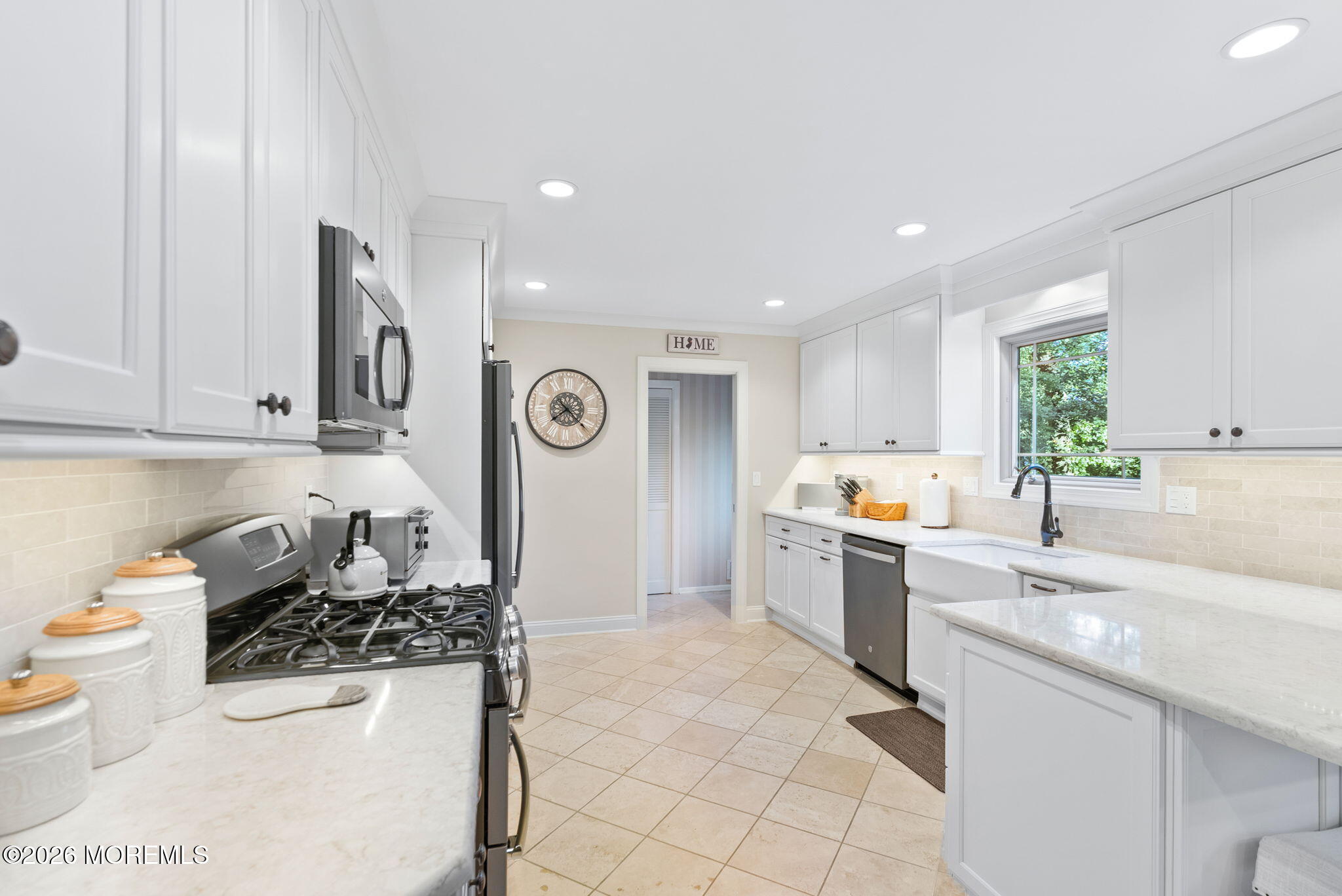 21 Stoney Brook Road Holmdel, NJ 07733 - Photo 6 of 40 a kitchen with a sink a stove and cabinets