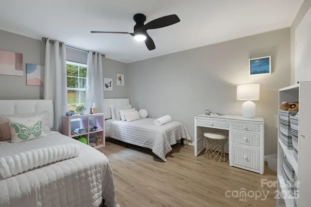 a bedroom with furniture and a fireplace