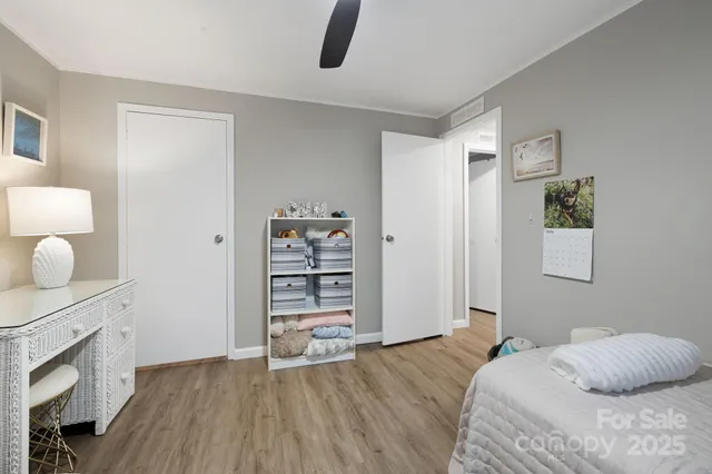 a bedroom with a bed and a television