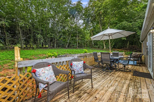 an outdoor space with furniture and umbrella