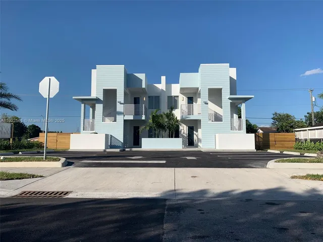 a view of a building with sitting area