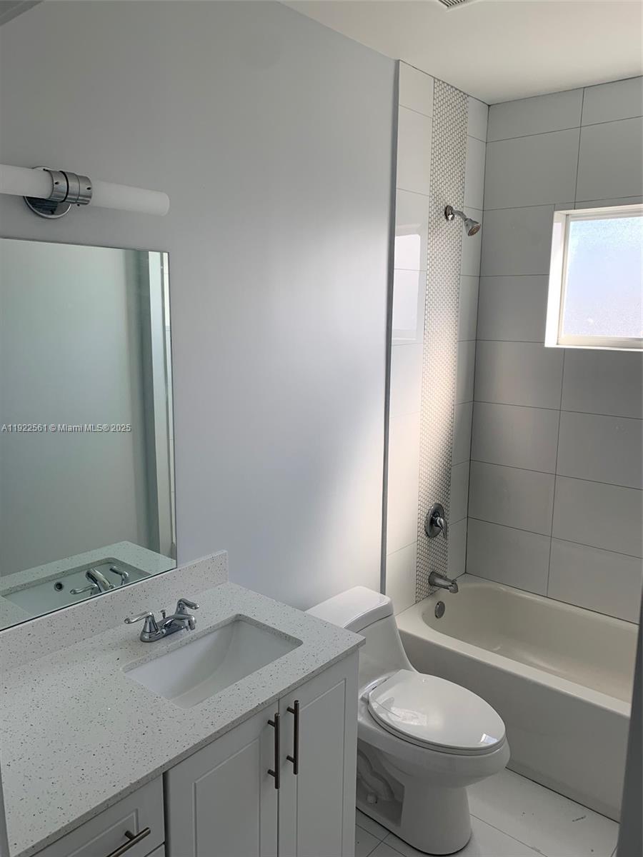 805 East 28th Street, Unit 805 Hialeah, FL 33013 - Photo 13 of 15 a bathroom with a sink toilet tub and shower