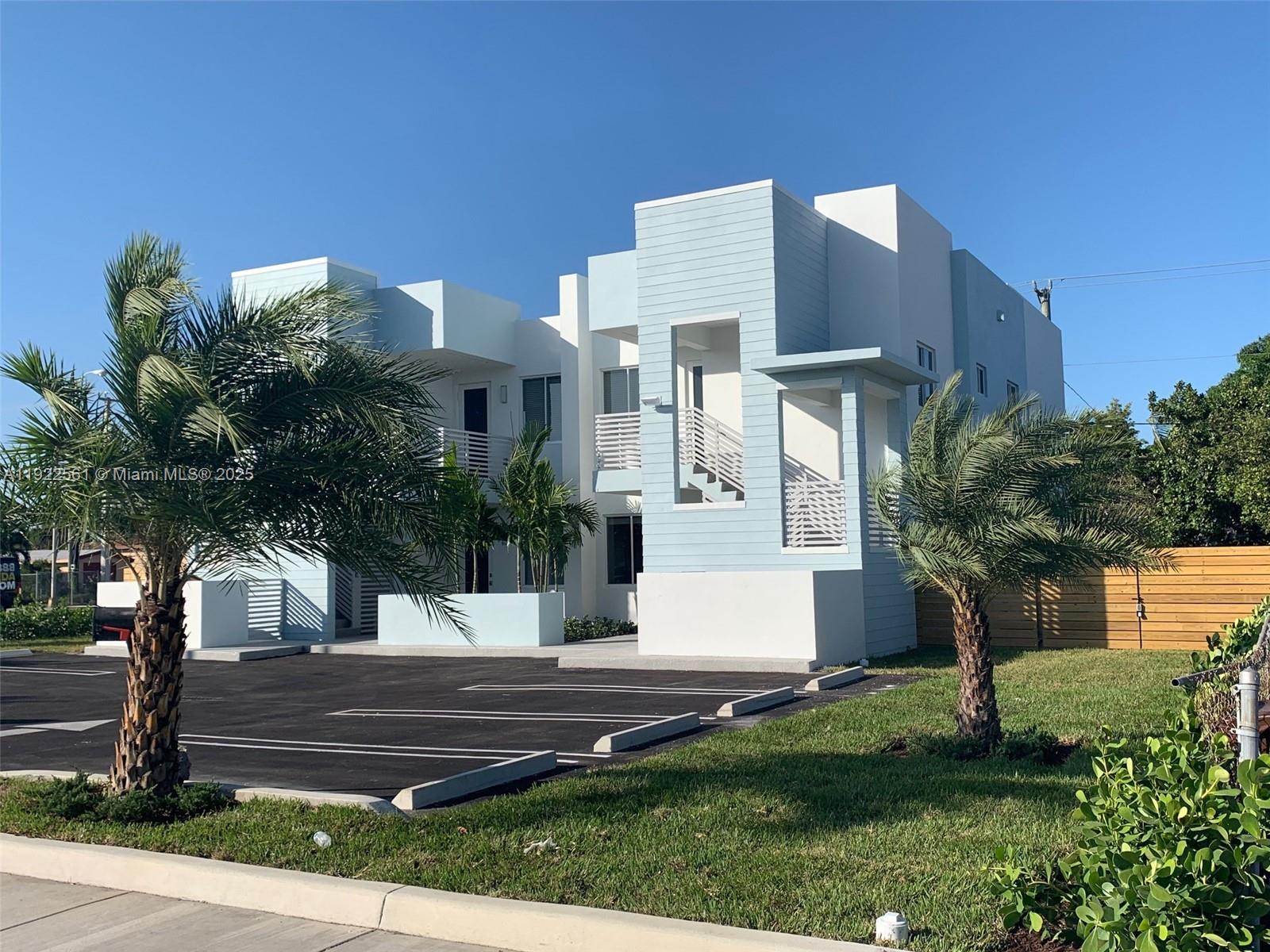 805 East 28th Street, Unit 805 Hialeah, FL 33013 - Photo 2 of 15 a front view of a house with a garden