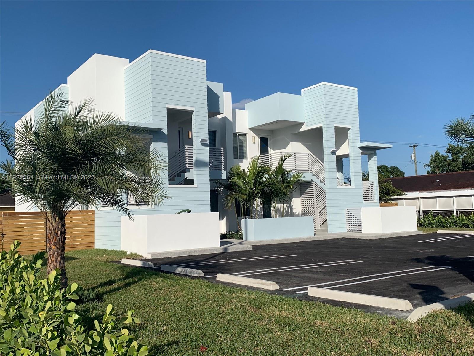 805 East 28th Street, Unit 805 Hialeah, FL 33013 - Photo 3 of 15 a front view of a house with garden