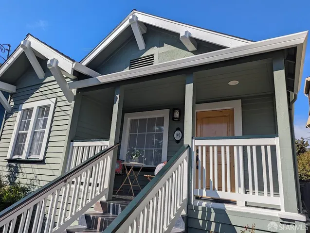 a view of wooden house with a large window