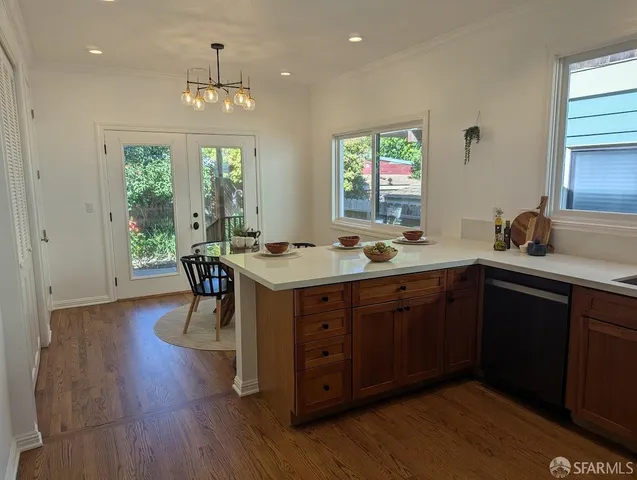 a kitchen with a table and chairs in it