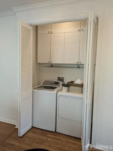 a view of storage and utility room with wooden floor