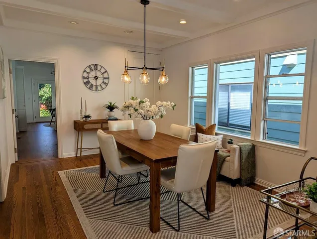 a view of a dining room with furniture window and wooden floor