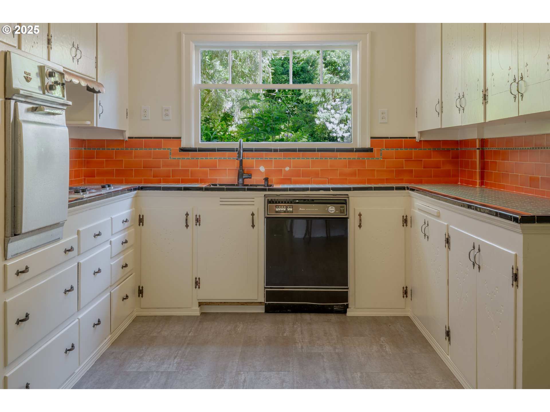 92216 Whiskey Road Warrenton, OR 97146 - Photo 18 of 48 a kitchen with stainless steel appliances cabinets and a window