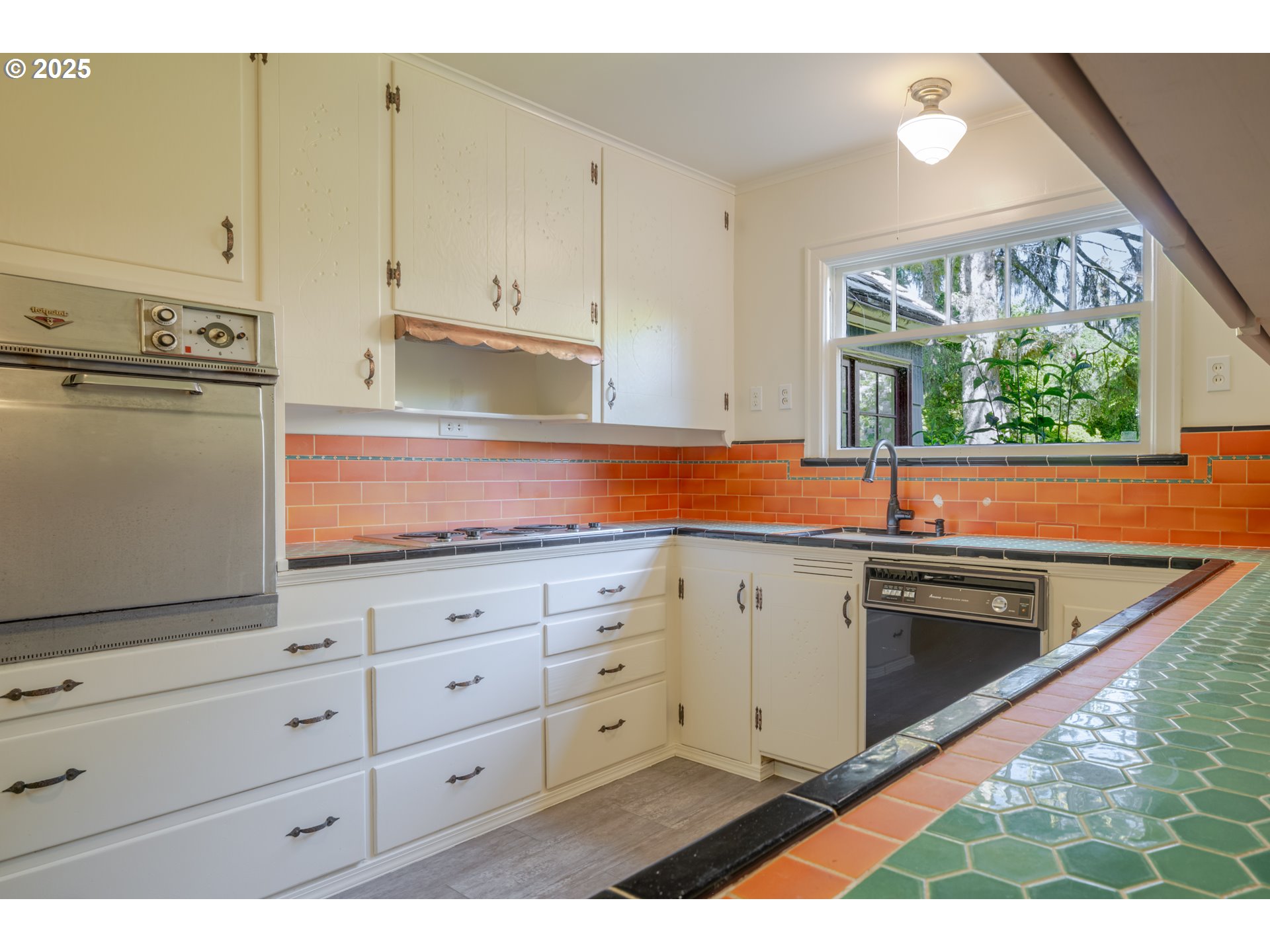 92216 Whiskey Road Warrenton, OR 97146 - Photo 19 of 48 a kitchen with granite countertop white cabinets and white appliances