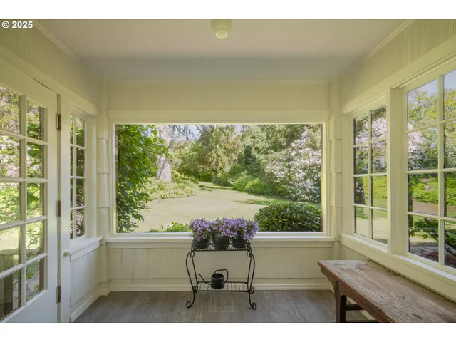 a view of house with backyard