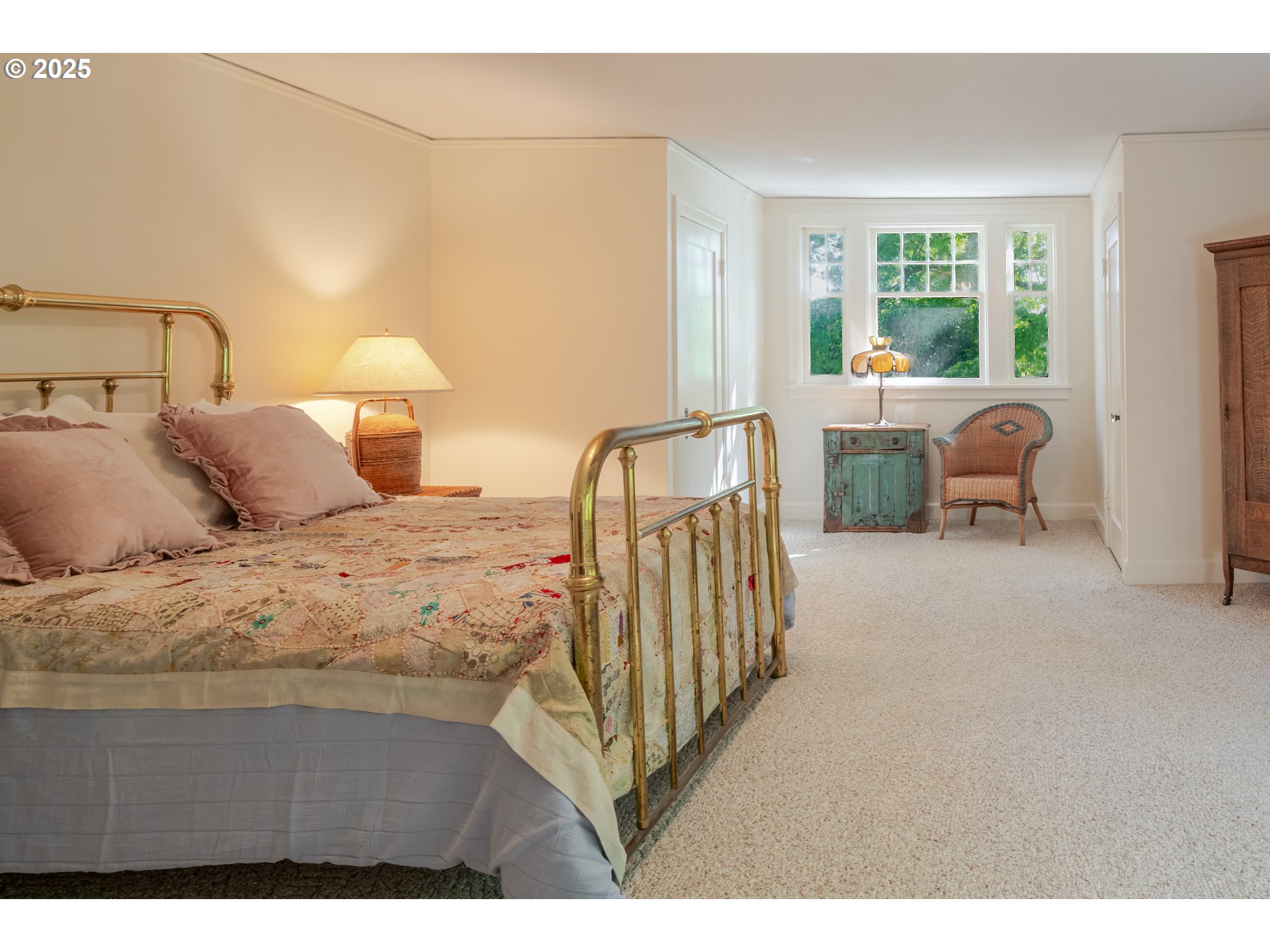 92216 Whiskey Road Warrenton, OR 97146 - Photo 27 of 48 a bedroom with a bed and a night stand