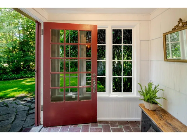 a view of front door of house and yard