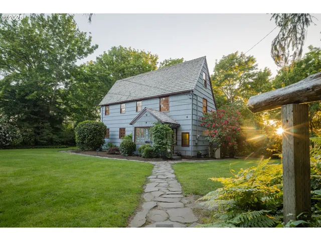 a front view of house with yard and green space