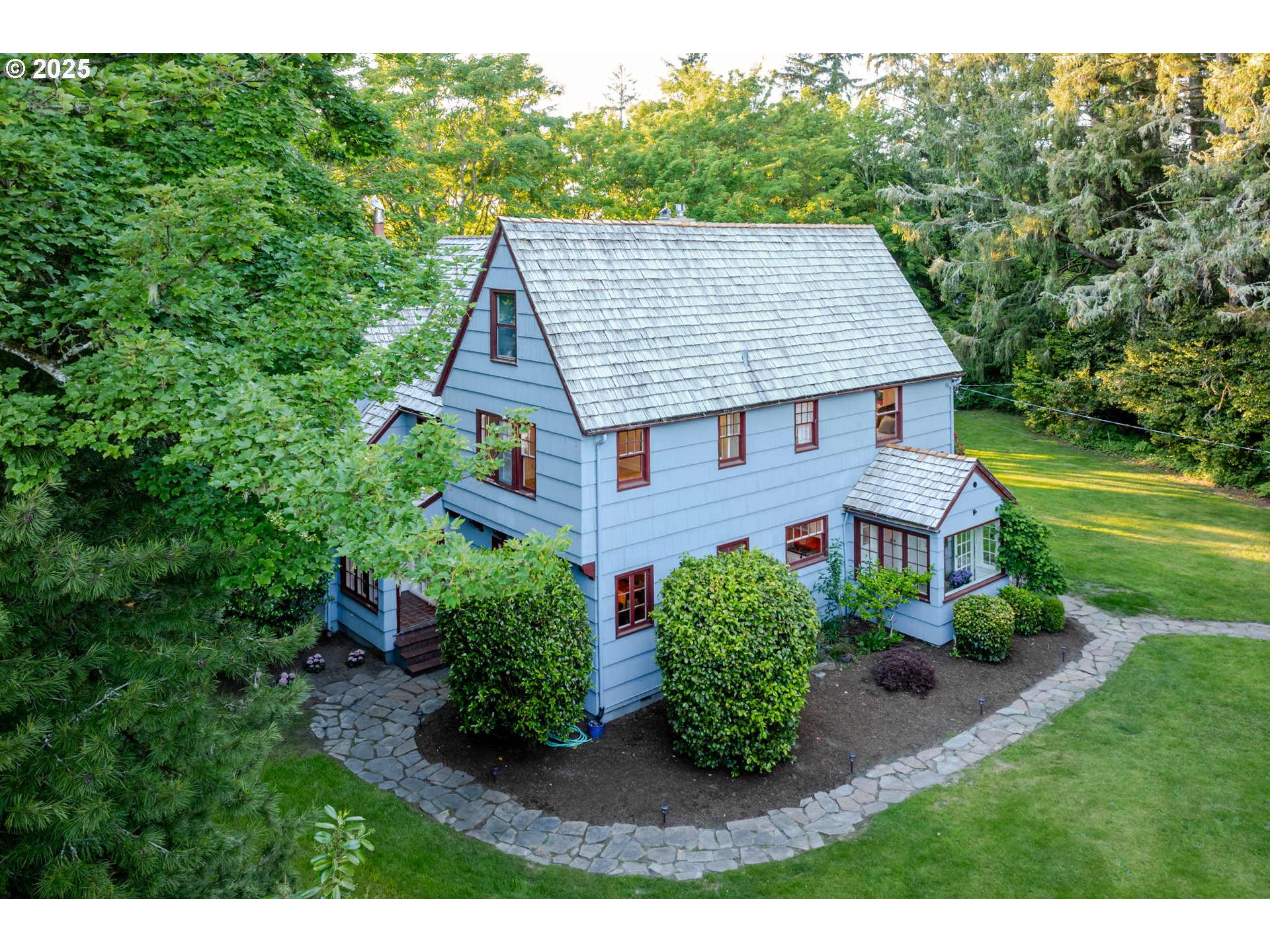 92216 Whiskey Road Warrenton, OR 97146 - Photo 47 of 48 a aerial view of a house next to a big yard and large trees
