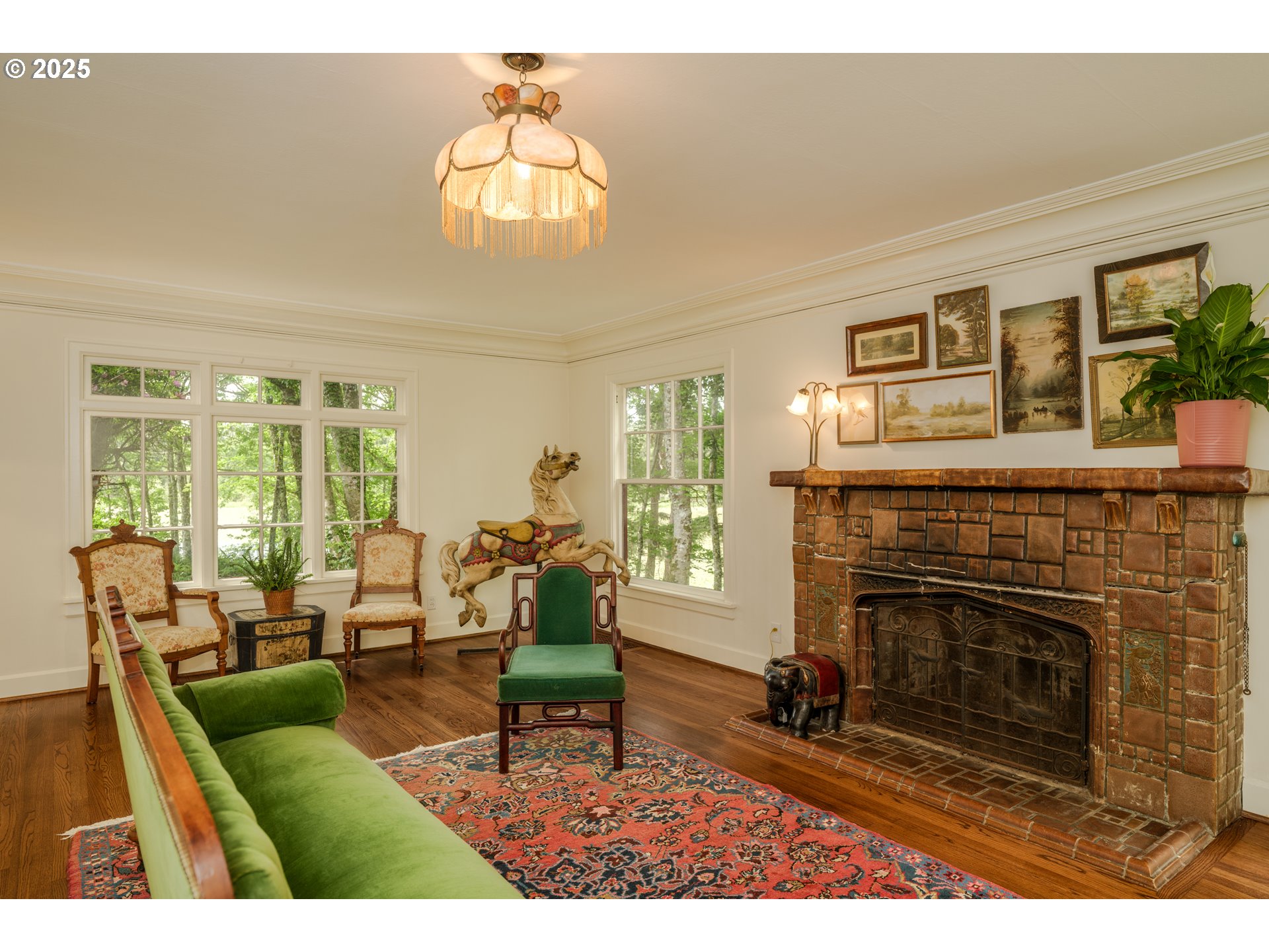 92216 Whiskey Road Warrenton, OR 97146 - Photo 6 of 48 a living room with furniture a fireplace and a large window