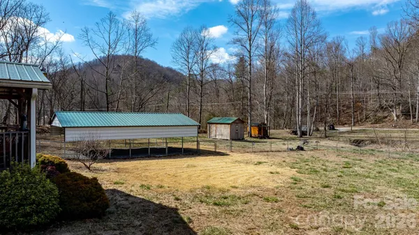 a view of a backyard with trees