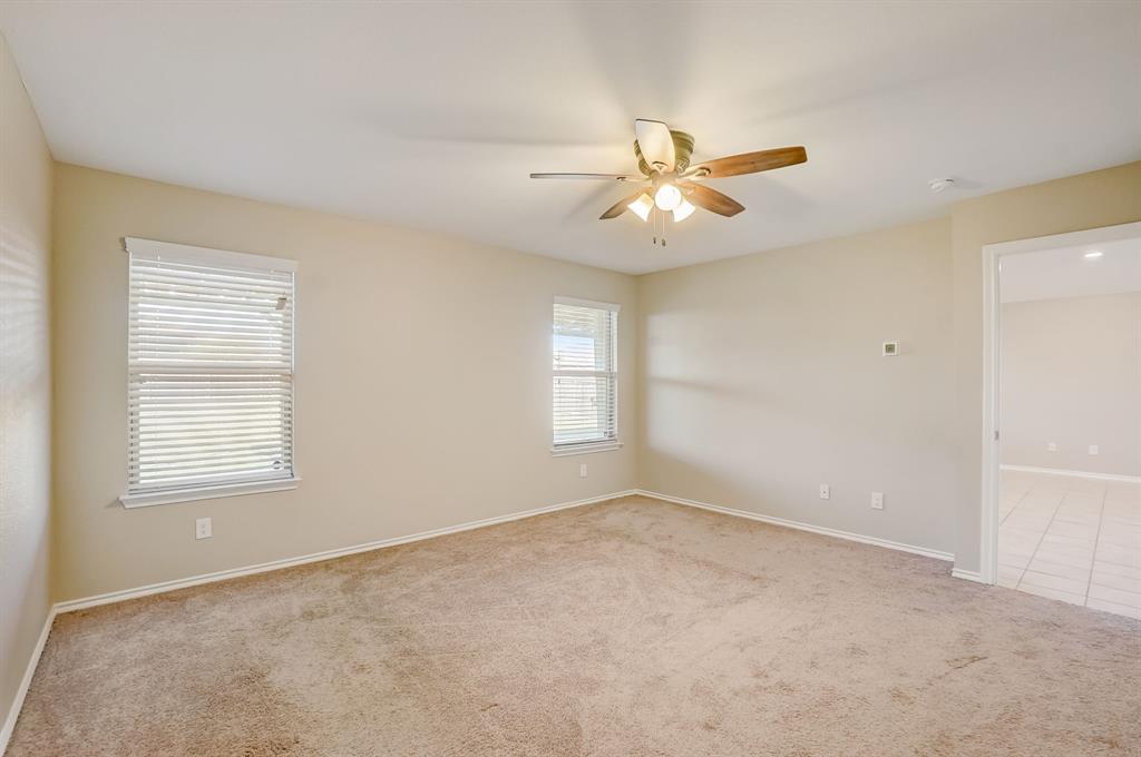 2113 Rubin Road Fate, TX 75189 - Photo 11 of 37 Empty room featuring light colored carpet and a ceiling fan