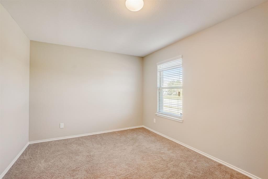 2113 Rubin Road Fate, TX 75189 - Photo 14 of 37 Carpeted empty room with baseboards