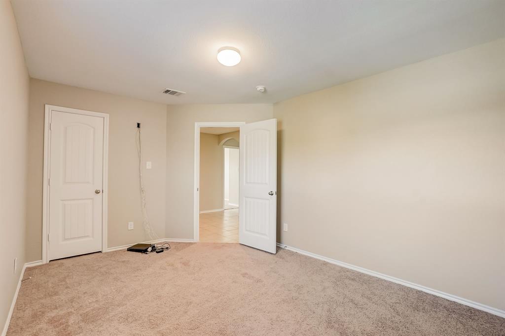 2113 Rubin Road Fate, TX 75189 - Photo 15 of 37 Unfurnished bedroom featuring carpet and baseboards