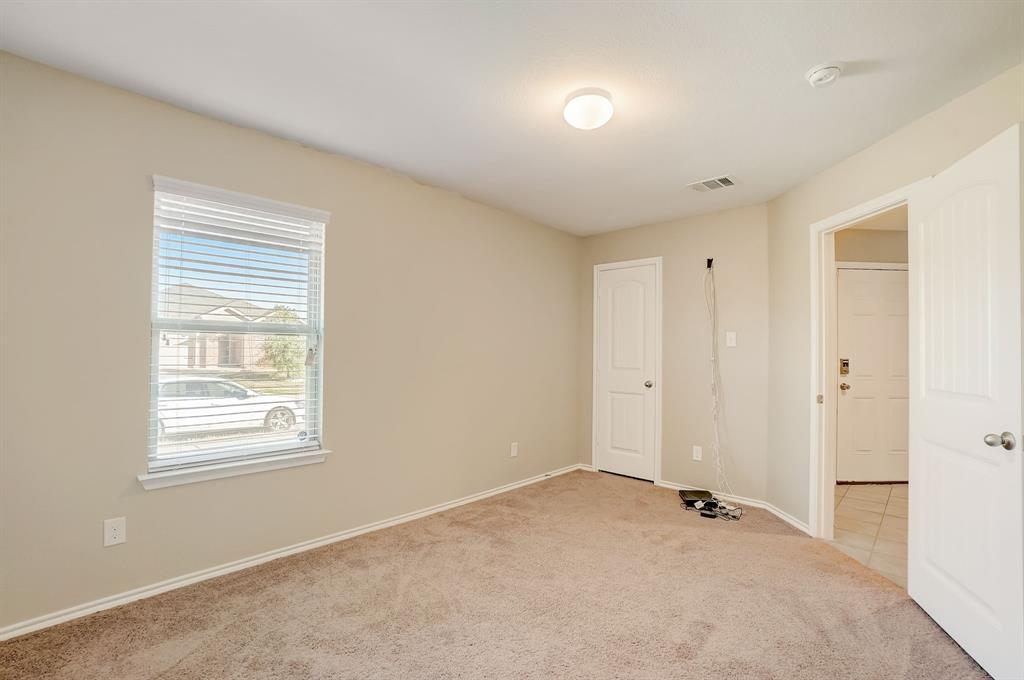 2113 Rubin Road Fate, TX 75189 - Photo 16 of 37 Spare room featuring light colored carpet and baseboards