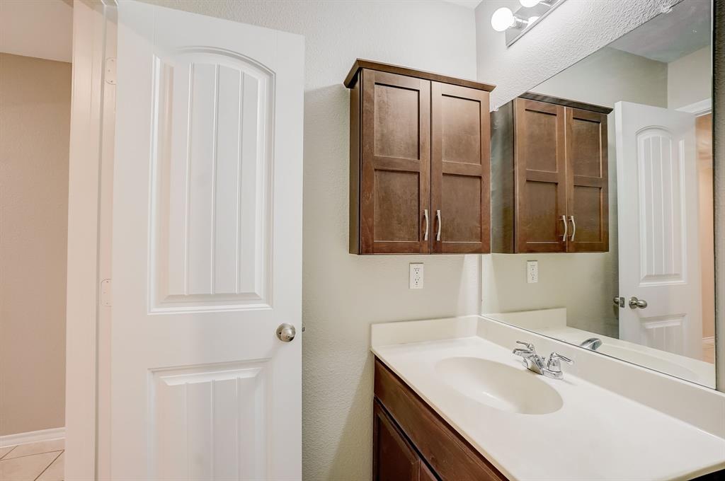 2113 Rubin Road Fate, TX 75189 - Photo 18 of 37 Bathroom with vanity and light tile patterned flooring