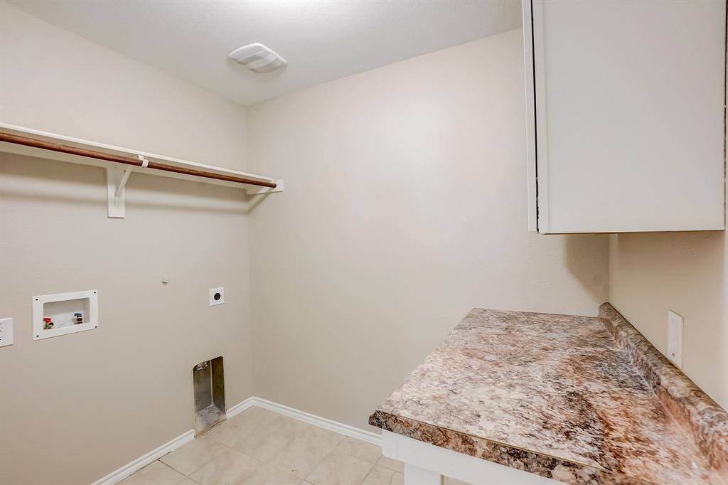 2113 Rubin Road Fate, TX 75189 - Photo 19 of 37 Laundry room with electric dryer hookup, light tile patterned floors, and washer hookup