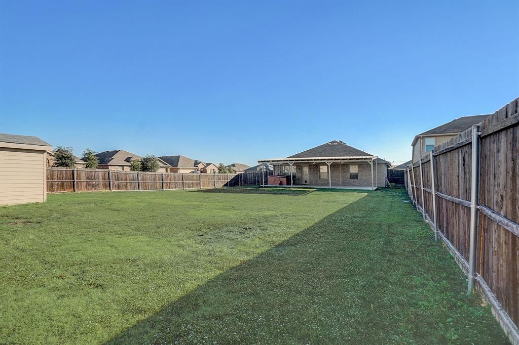 2113 Rubin Road Fate, TX 75189 - Photo 25 of 37 Fenced backyard with a patio