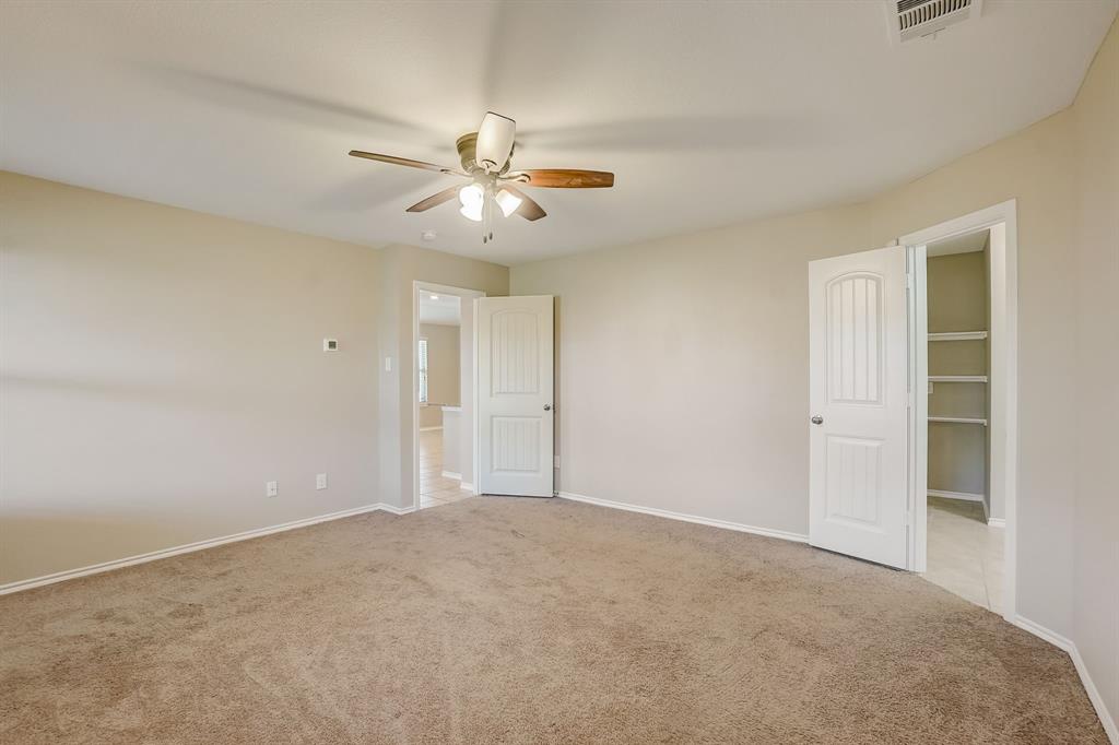 2113 Rubin Road Fate, TX 75189 - Photo 10 of 37 Unfurnished bedroom featuring light carpet and a ceiling fan