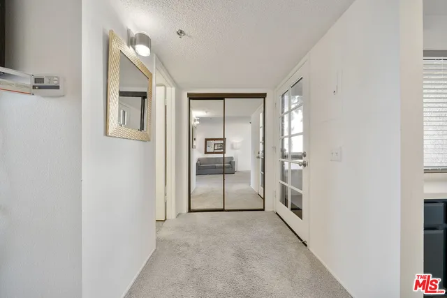 a view of a walk in closet and bedroom