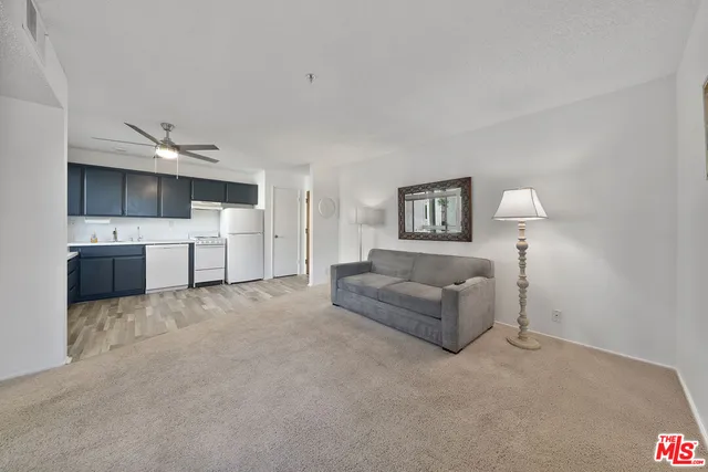 a kitchen with a refrigerator stove and sink