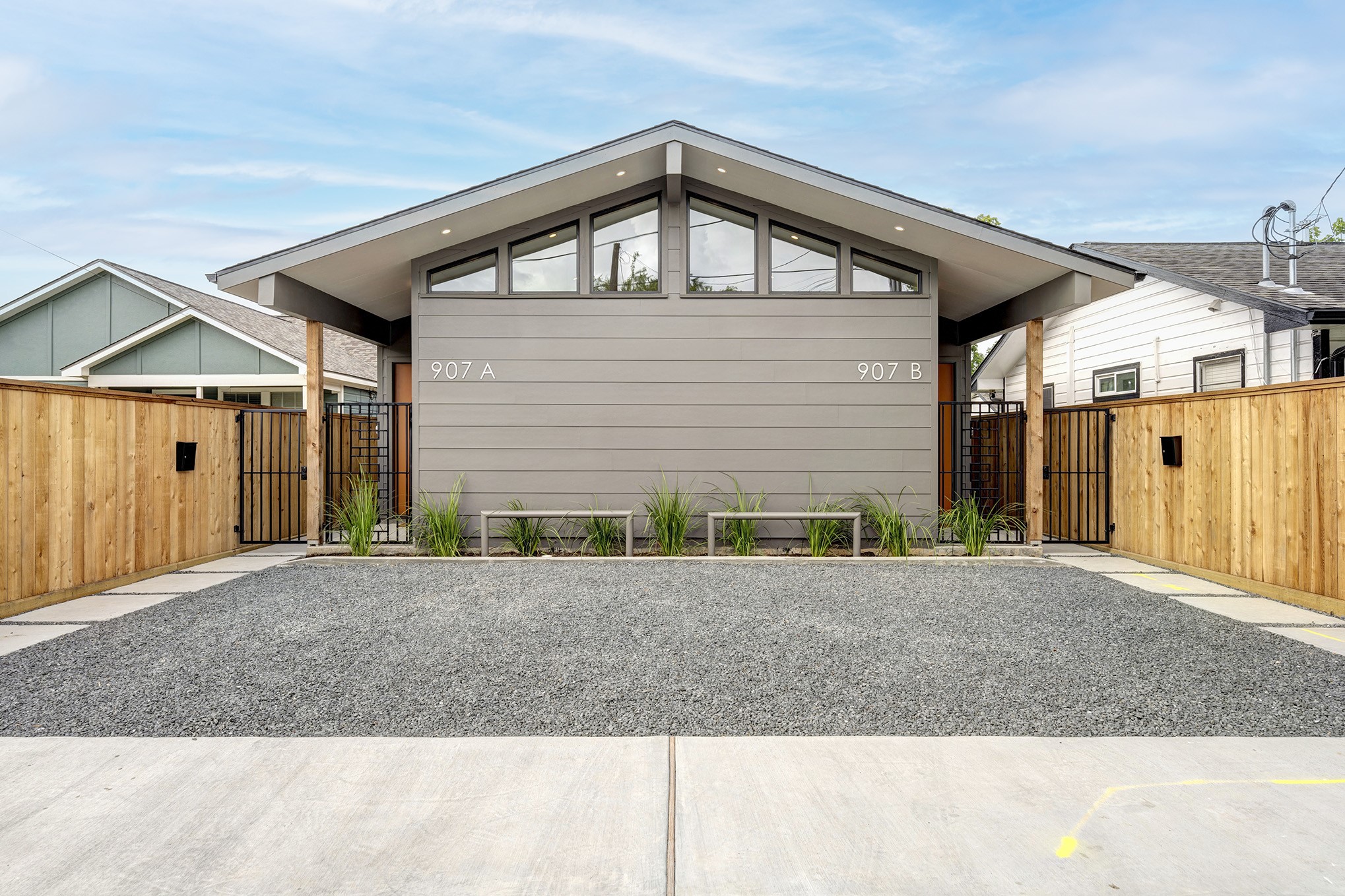 a front view of a house with garage