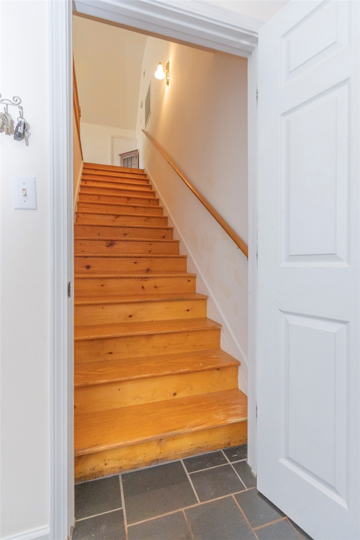 108 Pearman Drive Pendleton, SC 29670 - Photo 34 of 50 This interior staircase features natural wood steps and provides access to upper levels.
