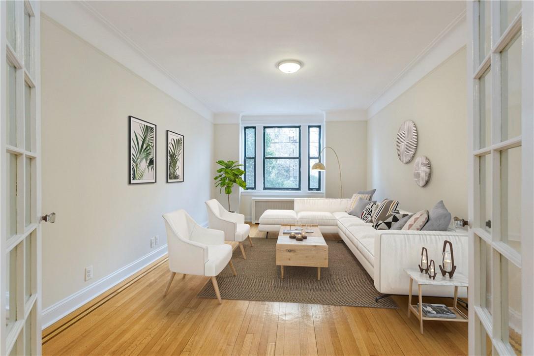 31 Pondfield Road, Unit 9 Bronxville, NY 10708 - Photo 1 of 1 a living room with furniture and a window