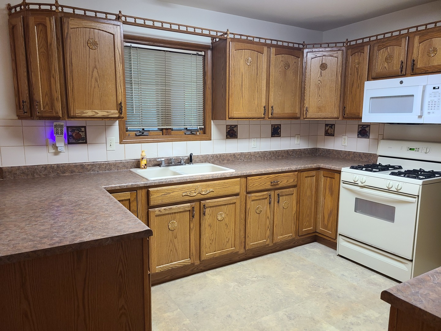 2871 East 777th Road Utica, IL 61373 - Photo 2 of 18 a kitchen with a sink stove and cabinets