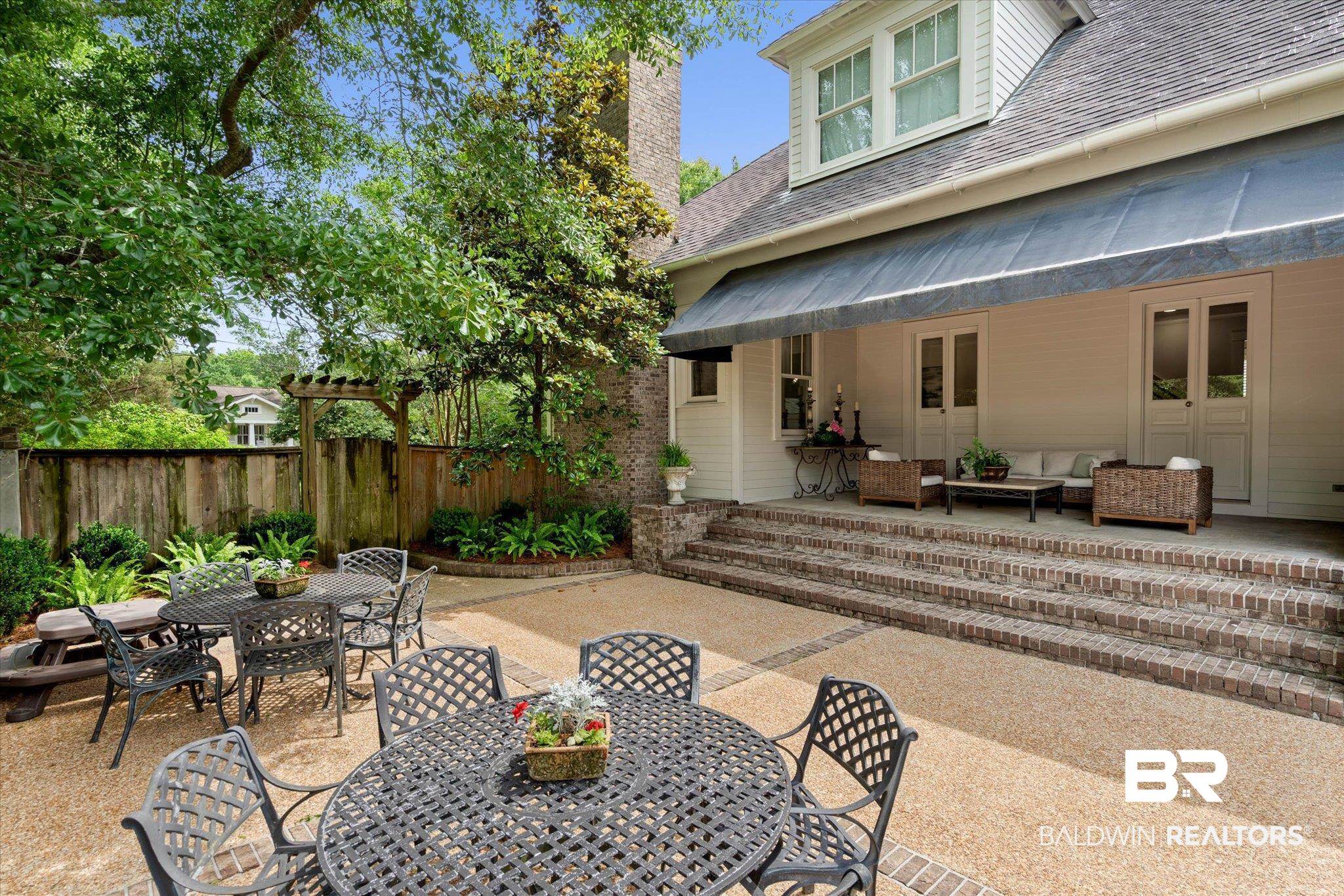 3813 Austill Lane Mobile, AL 36608 - Photo 29 of 37 Expansive outdoor patio featuring exposed aggregate paving and brick detailing